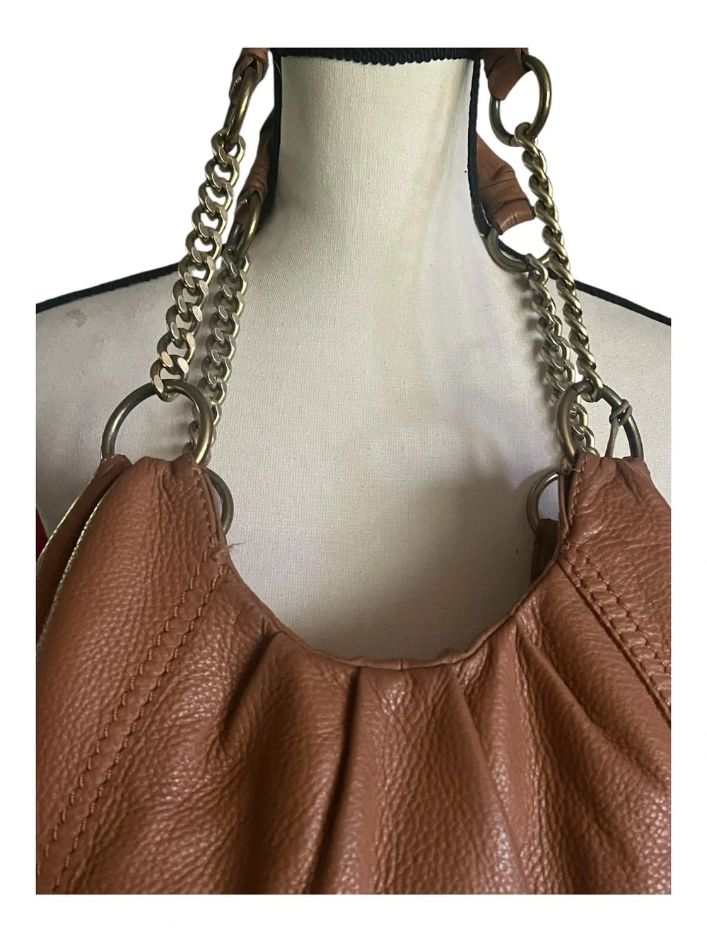 The Sac Pebbled Leather slouchy Hobo Tassel sides  shoulder handbag.